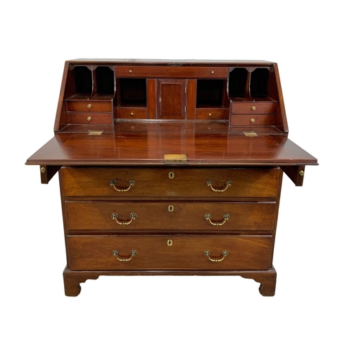 815 - A large Georgian mahogany writing bureau with brass drop handles. Circa 1760-80. 102.5 x 56.5 x 109.... 