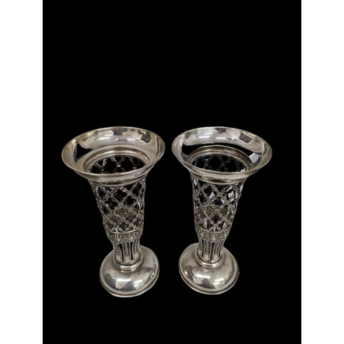 734 - A pair of ornate silver vases, Chester 1956. 398.5 grams filled, 18cm