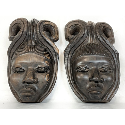 209 - A pair of early 20th century African wall hangings. Circa 1900. 23 x 36cm