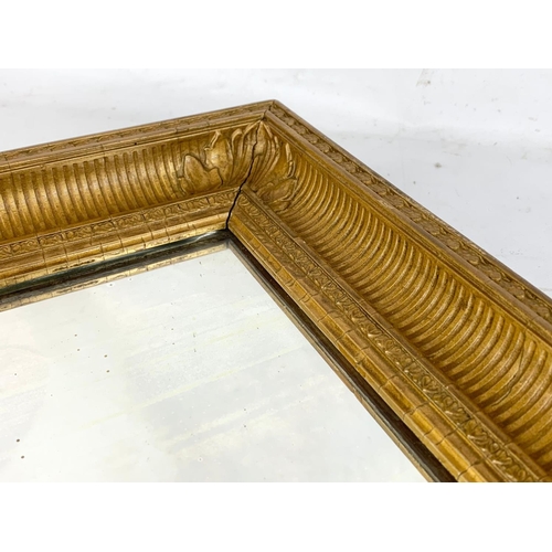 217 - A vintage gilt framed mirror. 32 x 42.5cm.