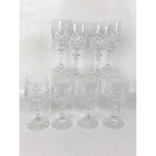 587 - 4 sets of crystal wine glasses.