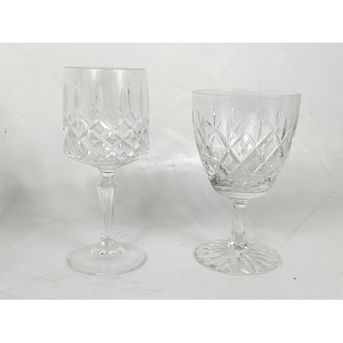 587 - 4 sets of crystal wine glasses.