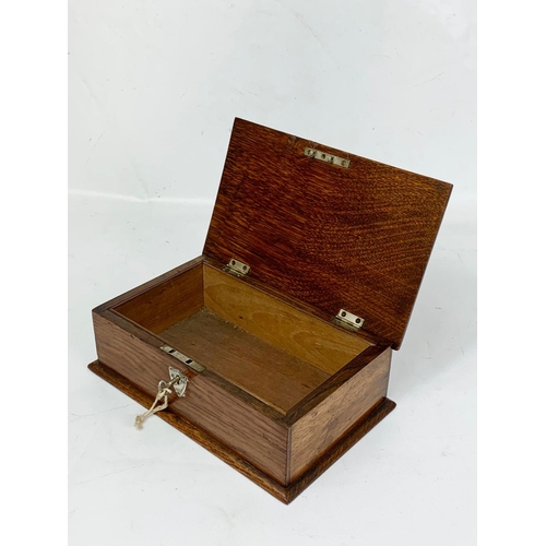 1 - An Edwardian oak cigar box with sterling silver mounts, London 1902. 24.5 x 15.5 x 8cm.