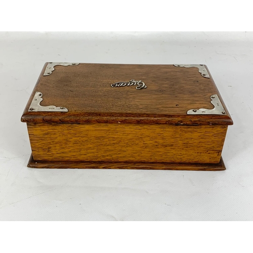 1 - An Edwardian oak cigar box with sterling silver mounts, London 1902. 24.5 x 15.5 x 8cm.