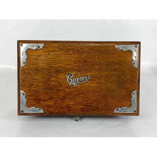 1 - An Edwardian oak cigar box with sterling silver mounts, London 1902. 24.5 x 15.5 x 8cm.