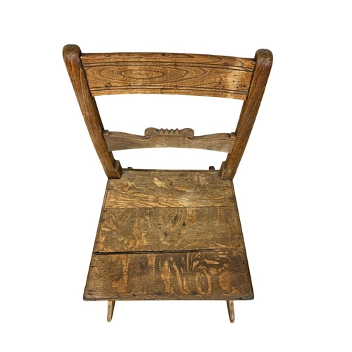 1002 - A small Orkney oak and elm rocking chair. Early 19th century. Circa 1820