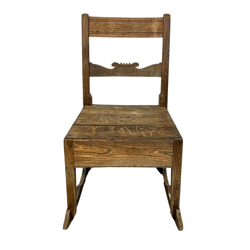 1002 - A small Orkney oak and elm rocking chair. Early 19th century. Circa 1820