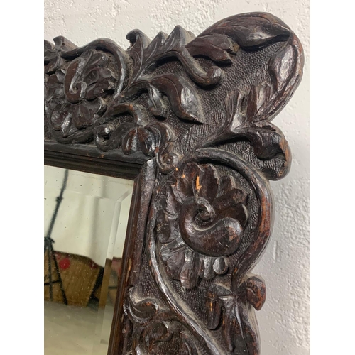 1004 - A 19th century Chinese carved frame mirror. Circa 1880. 69 x 72cm