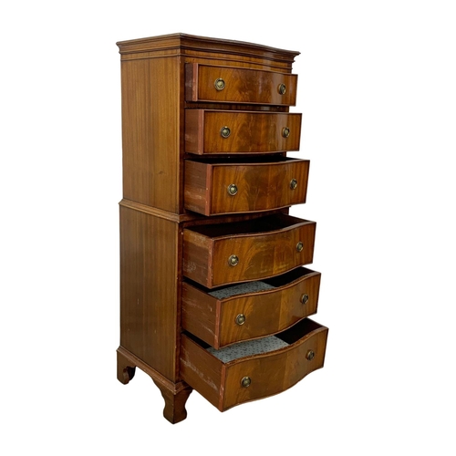 1006 - A tall Georgian style mahogany serpentine front chest of drawers. 55 x 41 x 131cm.