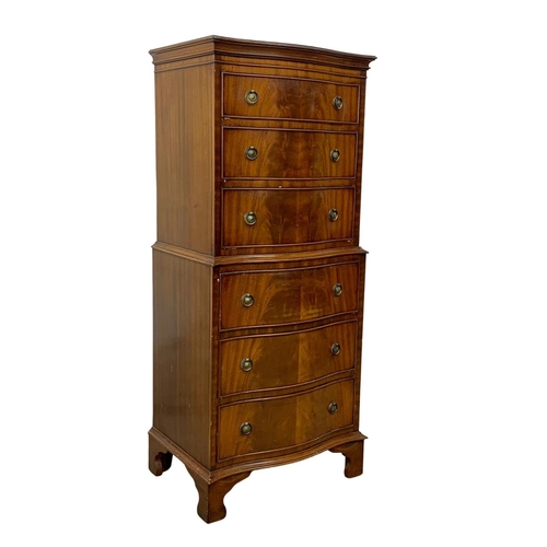 1006 - A tall Georgian style mahogany serpentine front chest of drawers. 55 x 41 x 131cm.