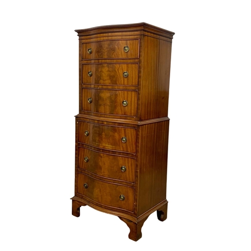 1006 - A tall Georgian style mahogany serpentine front chest of drawers. 55 x 41 x 131cm.