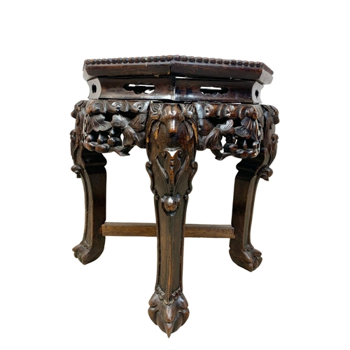 1008 - A late 19th century carved marble top plantstand. 32 x 45cm