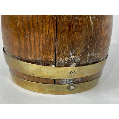 101 - An Edwardian oak brass bound biscuit barrel and a pair of small Mortar & Pestals.