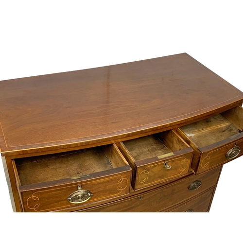 1011 - A large Georgian inlaid mahogany bow front chest of drawers. Circa 1800-1820. 113.5 x 57 x 105cm.