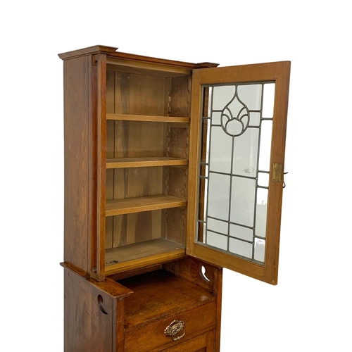 1013 - An Arts & Crafts oak single display cabinet. Circa 1900. 62 x 47.5 x 198cm