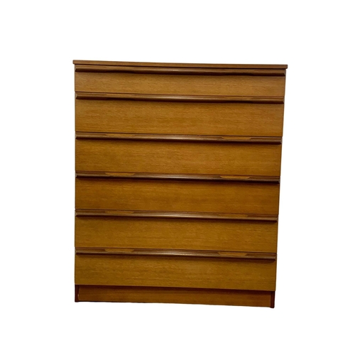 1015 - An Avalon teak Mid Century chest of drawers. 82 x 45 x 97cm.