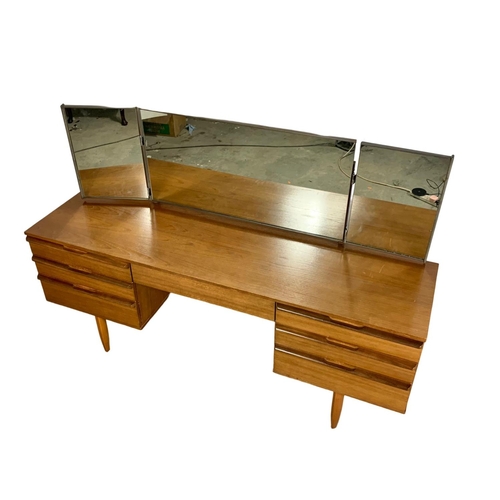 1016 - An Avalon teak Mid Century dressing table. 163 x 45 x 111cm