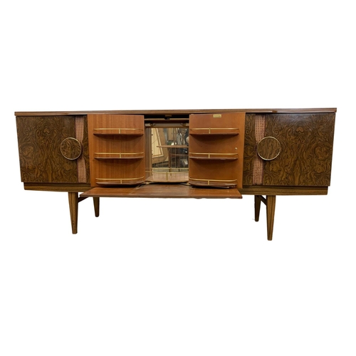 1018 - A Mid Century melamine cocktail sideboard by Beautility. 183.5 x 48 x 77.5cm