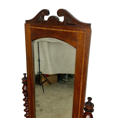 1021 - An inlaid mahogany cheval dressing mirror made from Victorian parts. 165cm