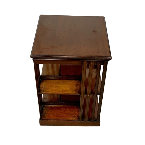 1024 - An Edwardian mahogany revolving bookcase. 47 x 78cm.