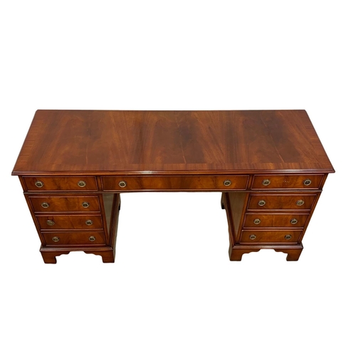 1027 - A Georgian style mahogany pedestal desk. 154 x 50 x 76cm.