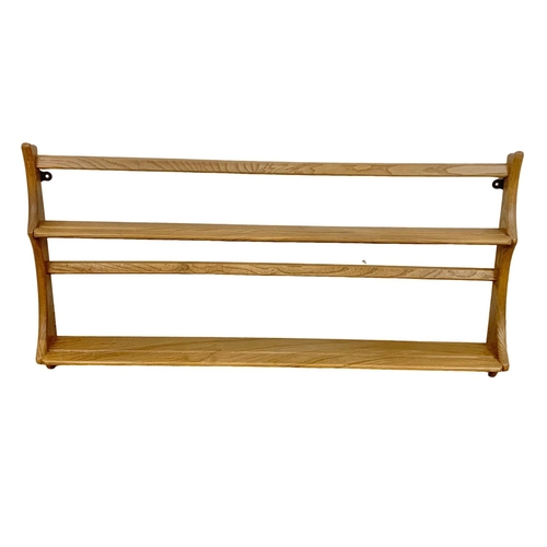 1040 - An Ercol Blonde elm plate rack. 96.5cm