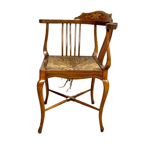 1042 - An Edwardian inlaid mahogany corner chair.