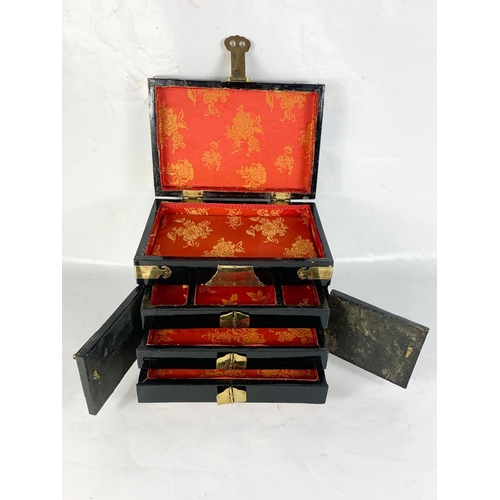 118 - A vintage Chinese lacquered brass bound jewellery box with faux marble decoration. 31 x 21 x 25cm