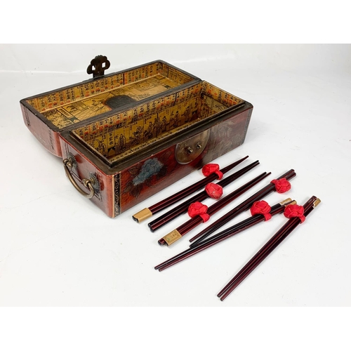 119 - A Chinese wooden incense box with chopsticks. 32 x 12.5 x 14.5cm