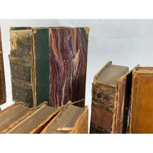 129 - A collection of early to late 19th century leather bound books.