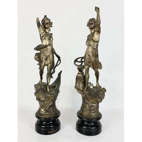 137 - A large 19th century French mantle clock on slate base with a pair of late 19th century spelter figu... 