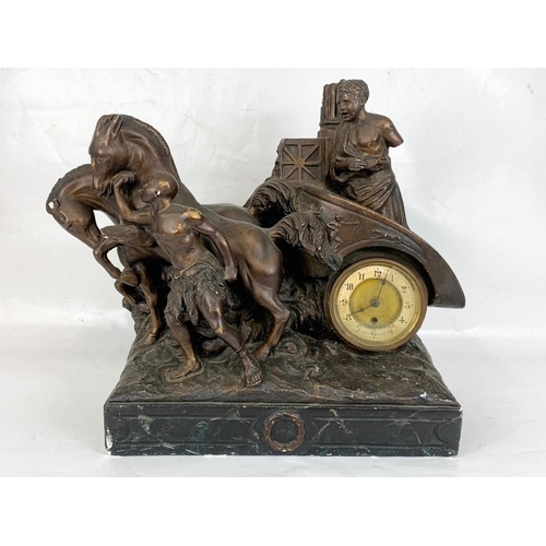 137 - A large 19th century French mantle clock on slate base with a pair of late 19th century spelter figu... 