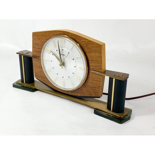 14 - A 1950’s-60’s Mid Century mantle clock by Metamec. In brass, onyx, leather and walnut. 29 x 15cm.