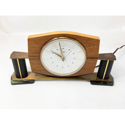 14 - A 1950’s-60’s Mid Century mantle clock by Metamec. In brass, onyx, leather and walnut. 29 x 15cm.