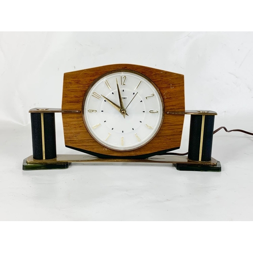 14 - A 1950’s-60’s Mid Century mantle clock by Metamec. In brass, onyx, leather and walnut. 29 x 15cm.