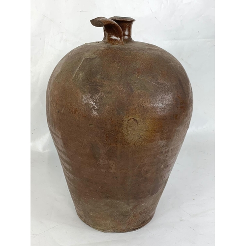 145 - An early 19th century stoneware flagon by Swaine. 43cm