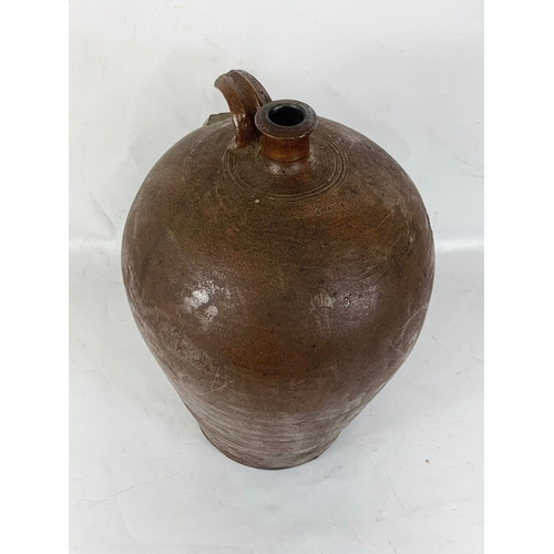 145 - An early 19th century stoneware flagon by Swaine. 43cm