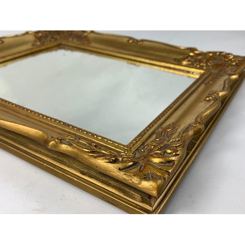 146 - A pair of ornate gilt framed mirrors. 31 x 36cm