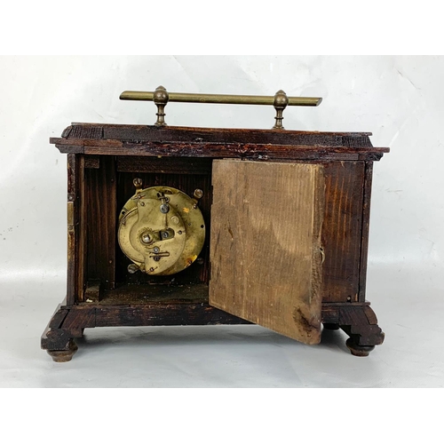 150 - An early 20th century barometer clock in oak case. Coca 1900. 29 x 11 x 23cm