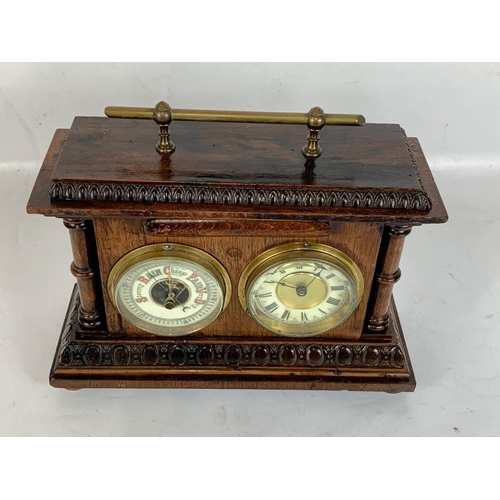 150 - An early 20th century barometer clock in oak case. Coca 1900. 29 x 11 x 23cm