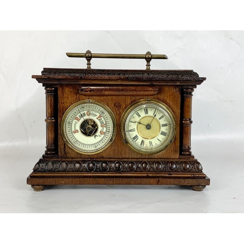 150 - An early 20th century barometer clock in oak case. Coca 1900. 29 x 11 x 23cm