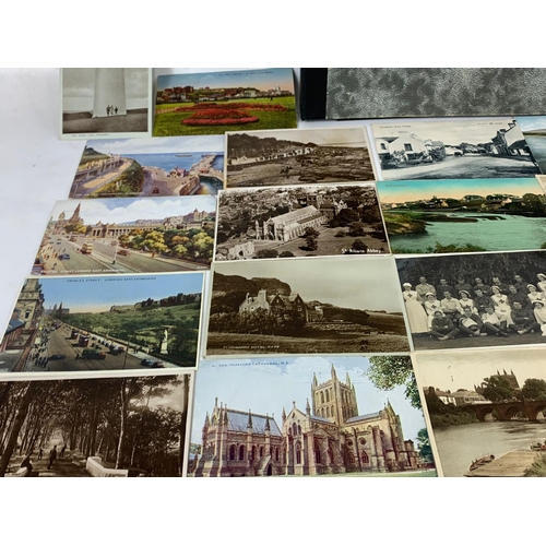 169 - A large quantity of vintage postcards. Mostly Irish.