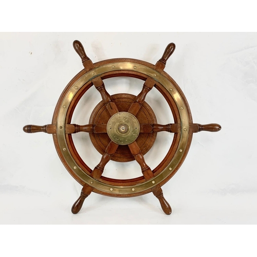 17 - A good quality late 19th century brass and oak ships wheel. 77cm