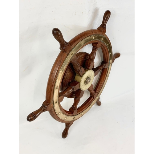 17 - A good quality late 19th century brass and oak ships wheel. 77cm