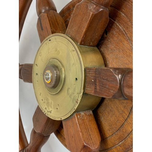 17 - A good quality late 19th century brass and oak ships wheel. 77cm