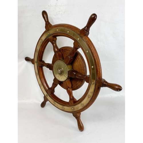 17 - A good quality late 19th century brass and oak ships wheel. 77cm