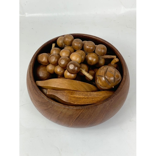 18 - A Mid Century teak fruit bowl with artificial wooden fruit. 1960’s. 26 x 11cm.