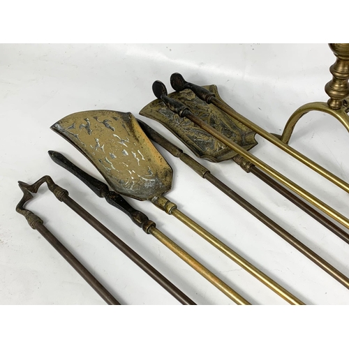 188 - 2 sets of late Victorian brass fire tools with a pair of firedogs. Tools measure 69cm