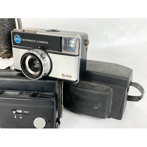 192 - A collection of vintage cameras. 2 Kodak Brownie’s, a Kodak Instamatic camera and an 845 Tele Motor