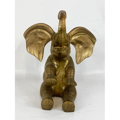 206 - A large heavy brass elephant. 37 x 46cm